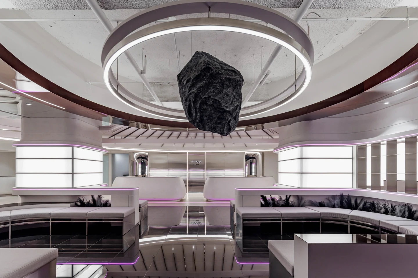 PLAN;S Clinic Gangnam lounge with circular lighting and a central suspended sculpture